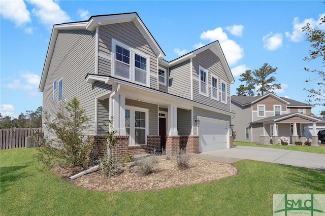 view of front of house featuring a garage, a porch, and a front yard