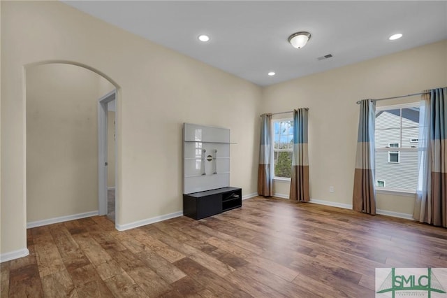 unfurnished living room featuring hardwood / wood-style floors