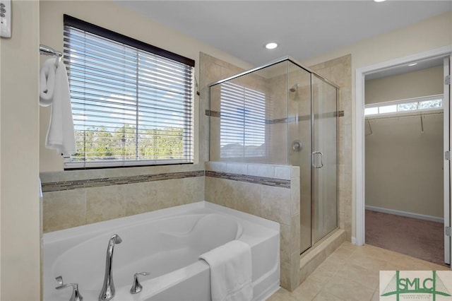 bathroom featuring tile patterned floors and independent shower and bath