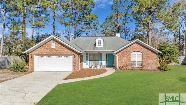 view of front of property with a garage and a front lawn