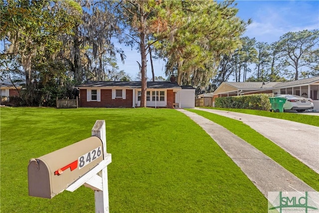 ranch-style home with a front lawn