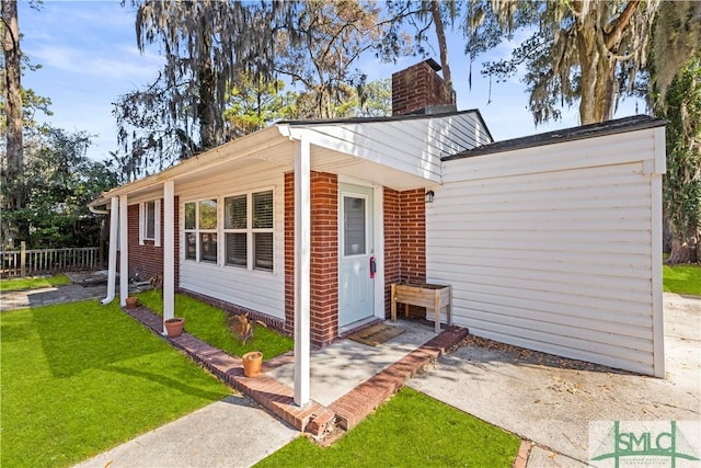 view of outdoor structure featuring a lawn