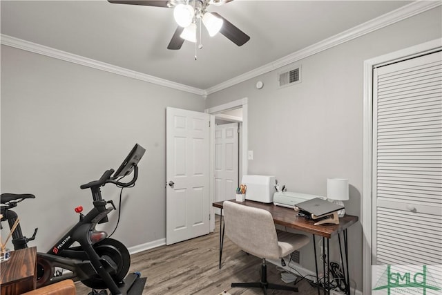 office with crown molding, light hardwood / wood-style flooring, and ceiling fan