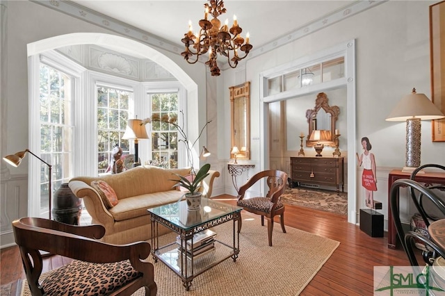 sitting room featuring hardwood / wood-style flooring and a notable chandelier