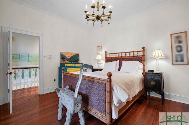 bedroom featuring crown molding, dark wood-type flooring, and a chandelier