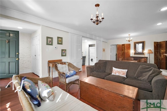 living room with wood-type flooring and a chandelier