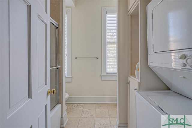 washroom with stacked washer / dryer