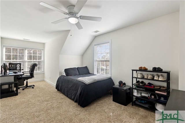 carpeted bedroom featuring lofted ceiling and ceiling fan