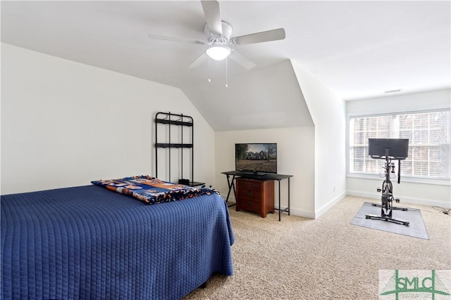 bedroom featuring lofted ceiling, ceiling fan, and carpet