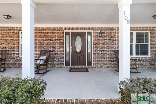 doorway to property featuring a porch