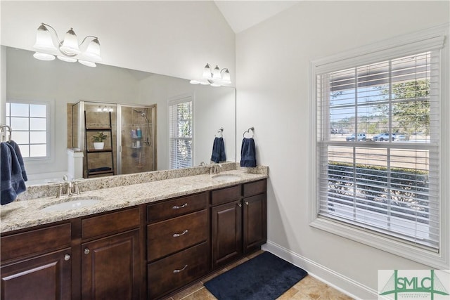 bathroom with lofted ceiling, vanity, a shower with door, tile patterned floors, and an inviting chandelier