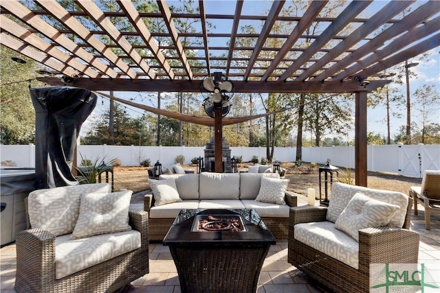 view of patio with an outdoor living space with a fire pit and a pergola