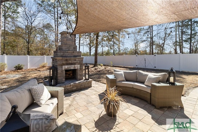 view of patio / terrace featuring an outdoor living space with a fireplace