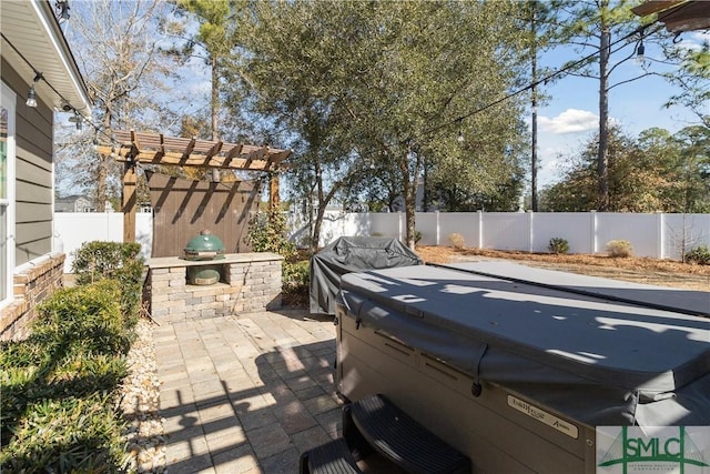 view of patio / terrace featuring a hot tub, a grill, and a pergola