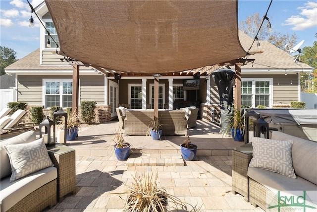 view of patio / terrace featuring an outdoor living space and a pergola