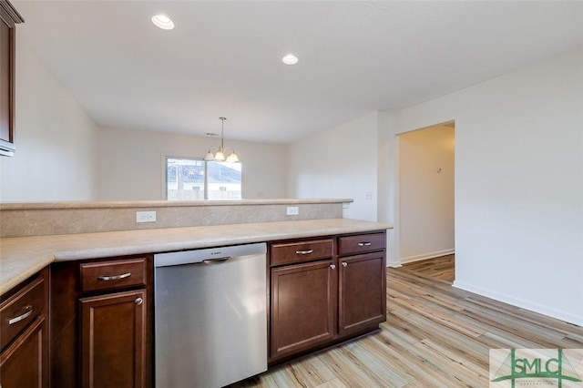 kitchen with pendant lighting, an inviting chandelier, dark brown cabinetry, stainless steel dishwasher, and light wood-type flooring