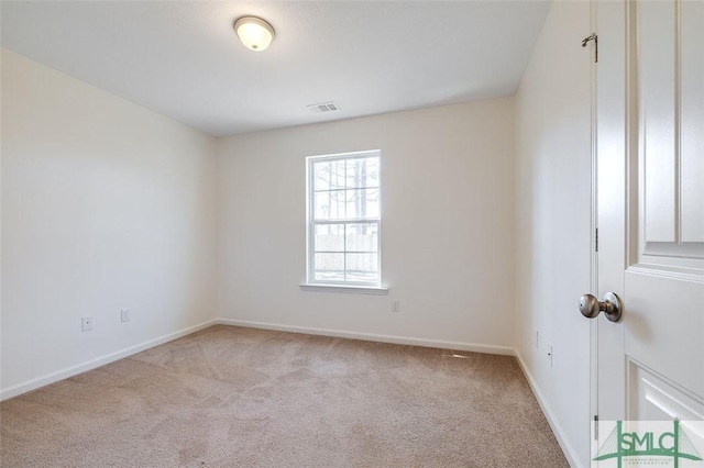 unfurnished room with light colored carpet