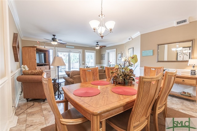 dining area with an inviting chandelier and ornamental molding