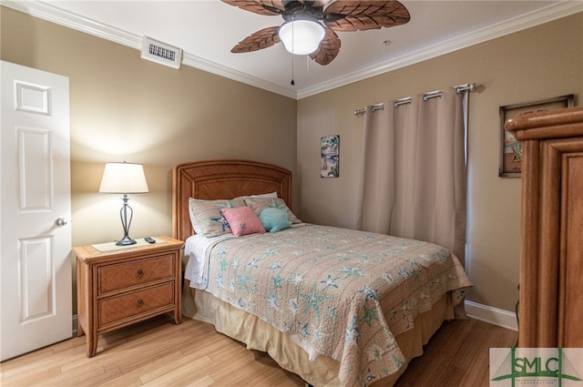 bedroom with crown molding, ceiling fan, and light hardwood / wood-style floors