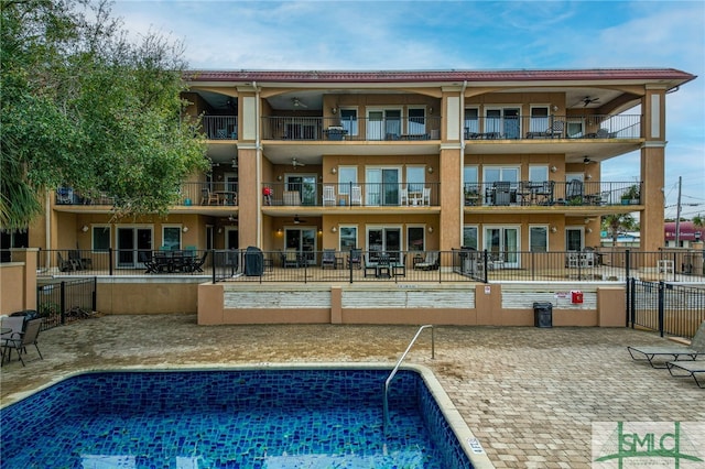 view of swimming pool with a patio