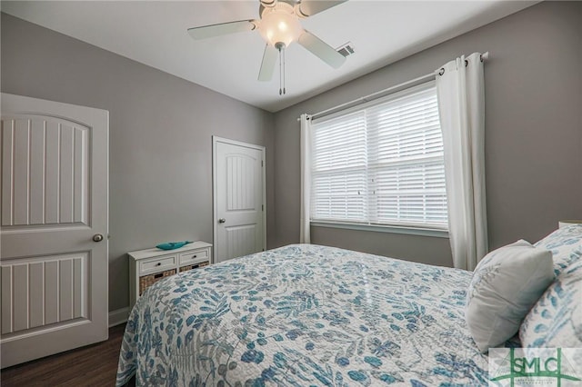 bedroom featuring dark hardwood / wood-style floors and ceiling fan