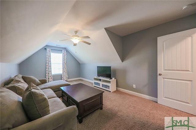 carpeted living room with vaulted ceiling and ceiling fan