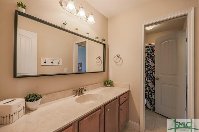 bathroom with vanity and tile patterned flooring