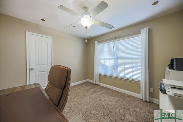 office space with carpet and ceiling fan