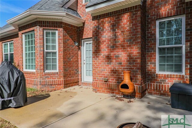 entrance to property with a patio area