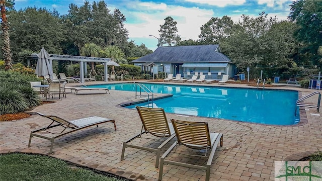 view of swimming pool featuring a pergola and a patio area