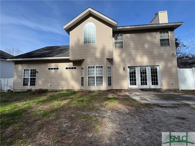 rear view of property featuring a patio area