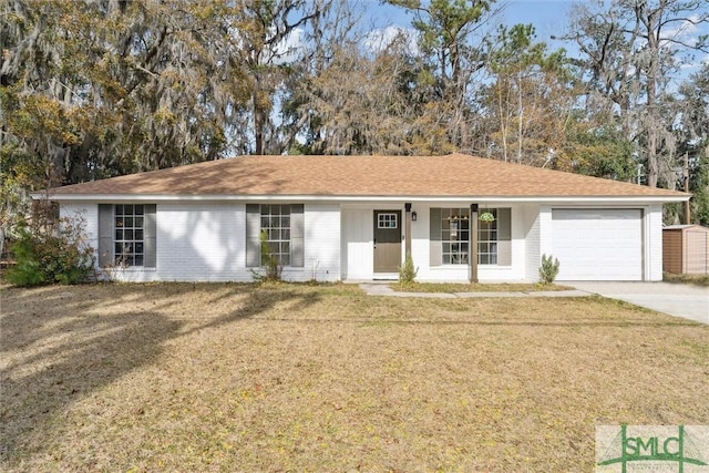 single story home featuring a porch, a garage, and a front yard