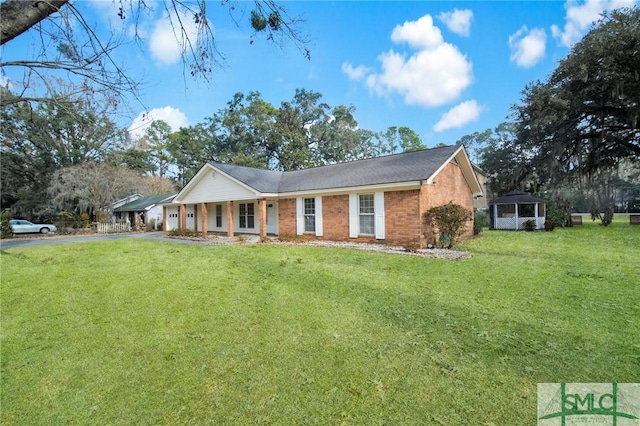 ranch-style house with a front yard