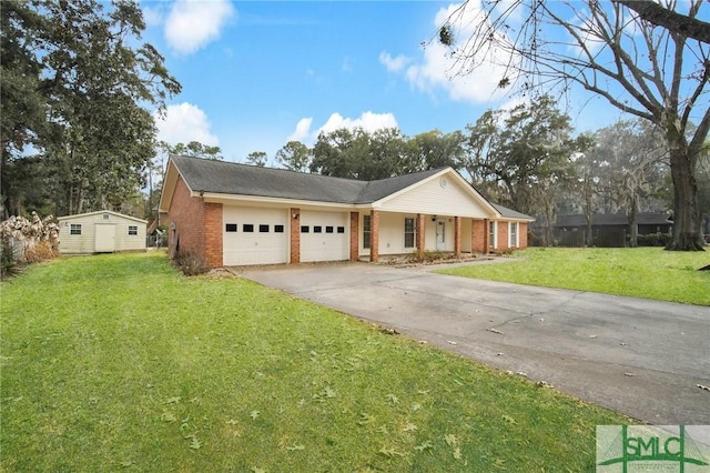 ranch-style home featuring a storage shed, a garage, and a front yard