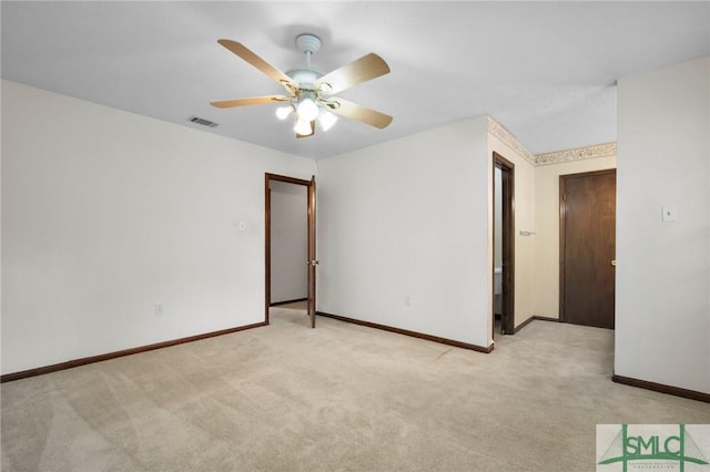 unfurnished room with light carpet and ceiling fan