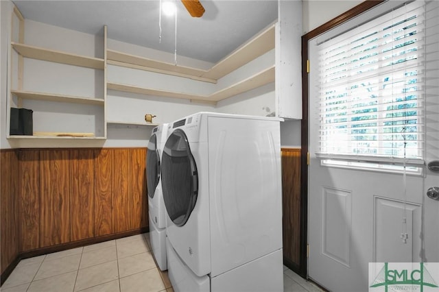 laundry room with ceiling fan, light tile patterned floors, and washer and clothes dryer