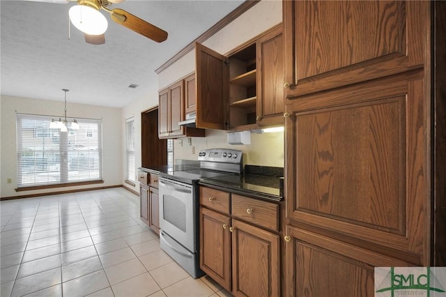 kitchen featuring stainless steel electric stove, ceiling fan with notable chandelier, decorative light fixtures, light tile patterned floors, and a textured ceiling