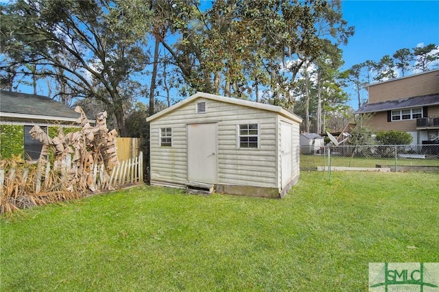 view of outbuilding featuring a yard