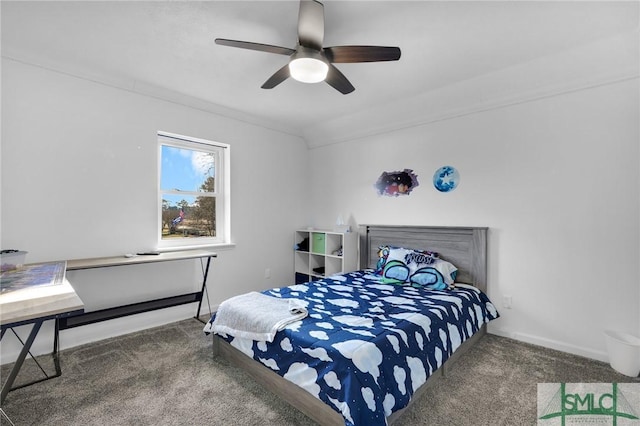 bedroom with ceiling fan and dark carpet