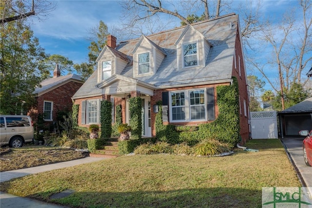 cape cod house with a front yard