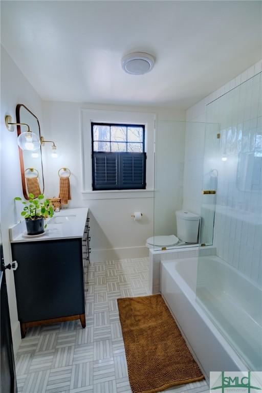 full bathroom with vanity, shower / bathtub combination, and toilet