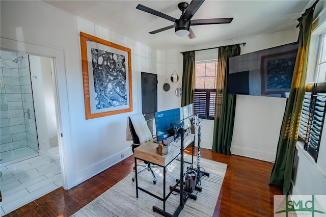 office area featuring ceiling fan and dark hardwood / wood-style floors