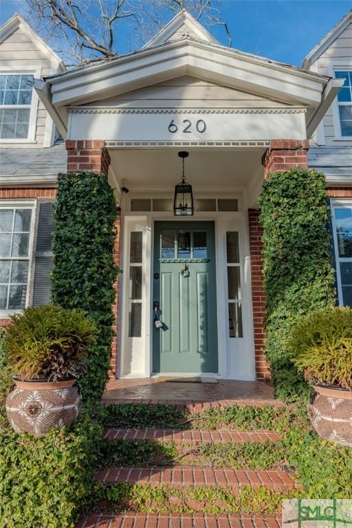 620 E 51st St, Savannah, GA 31405 - doorway to property featuring brick siding