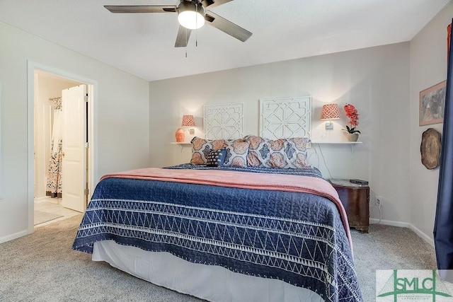 bedroom with carpet, baseboards, and ensuite bathroom