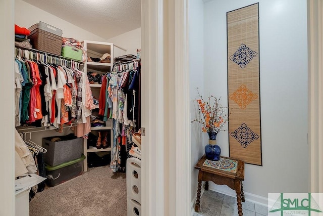 spacious closet featuring carpet floors