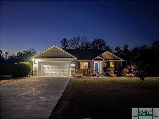 single story home featuring concrete driveway and an attached garage