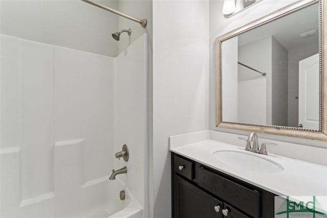 bathroom featuring bathing tub / shower combination and vanity