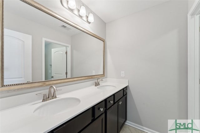 bathroom with vanity and tile patterned floors