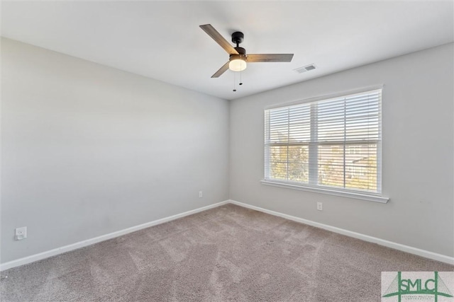 empty room featuring ceiling fan and carpet floors