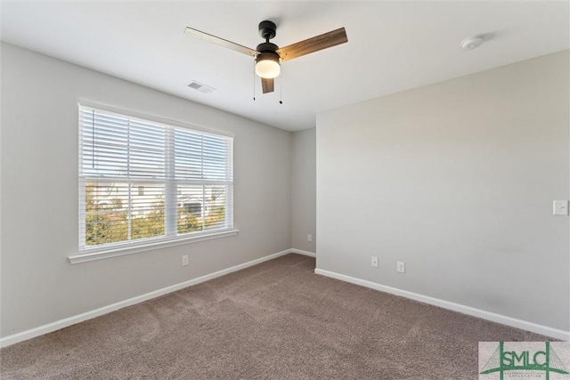 carpeted empty room with ceiling fan